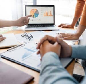 An image of personal brand strategists and public relations experts collaborating at a desk.